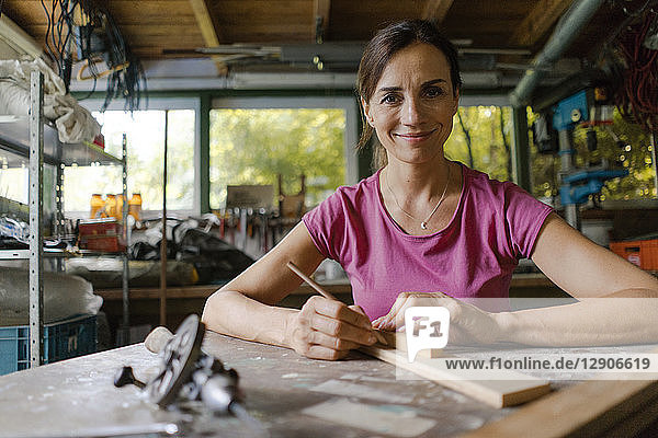 Portrait of a confident mature woman in her workshop