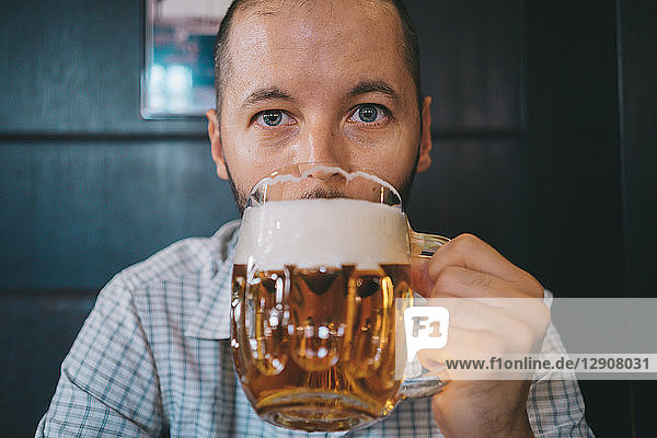 Czechia  portrait of man drinking beer in a pub