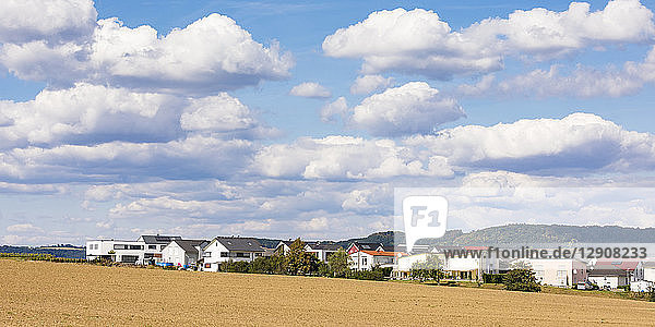 Germany  Baden-Wuerttemberg  Suessen  panoramic view of field and modern houses