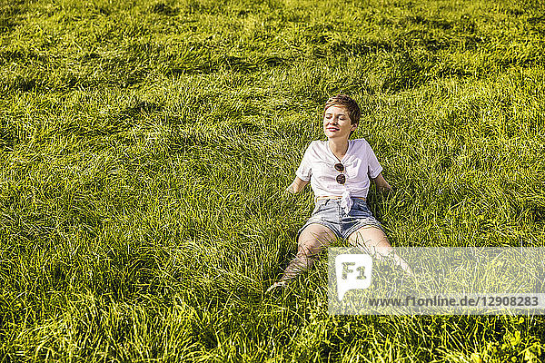 Woman in field enjoying sunlight