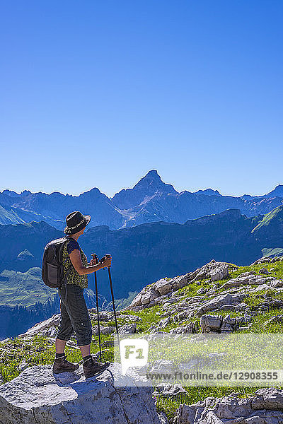 Germany  Bavaria  hiker at Koblat at Nebelhorn with Hochvogel Mountain in background