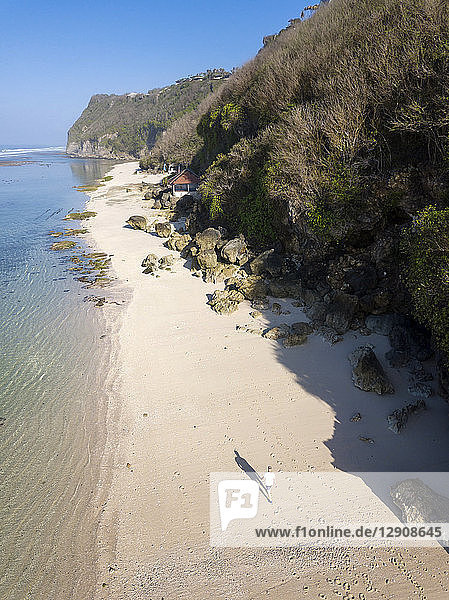 Indonesia  Bali  Aerial view of Karma Kandara beach  man walking on beach
