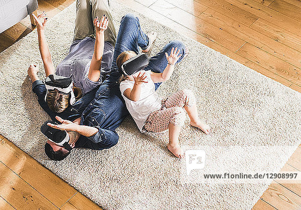 Family using VR goggles at home