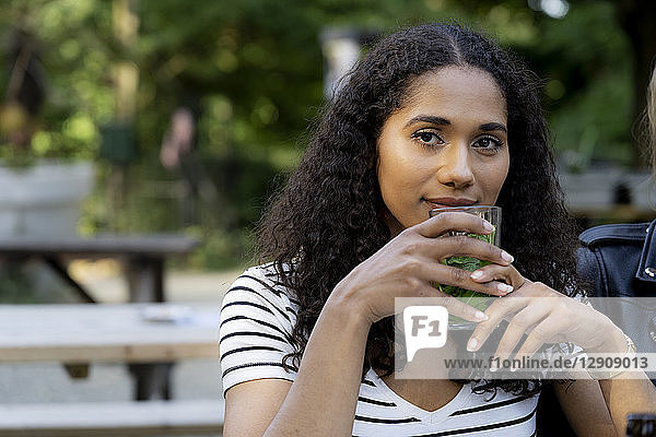 Young woman sitting in beer garden