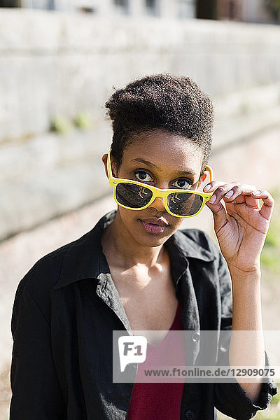 Portrait of young woman with sunglasses