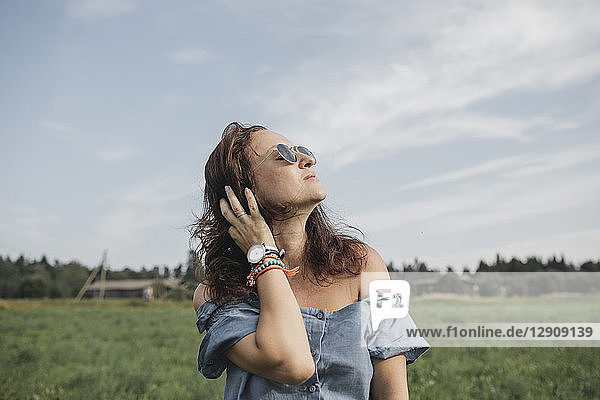 Relaxed woman on a rural field