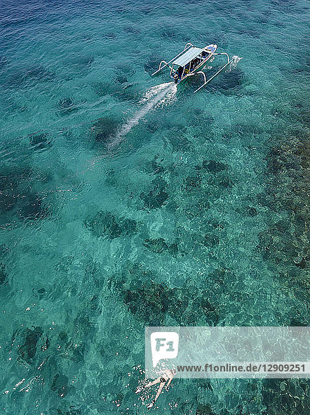 Indonesia  Bali  Aerial view of Blue Lagoon  snorkeler and banca boat