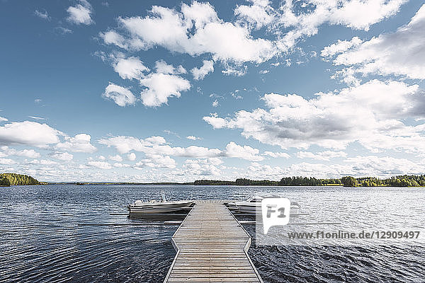 Finland  Jetty with boats in a remote lake