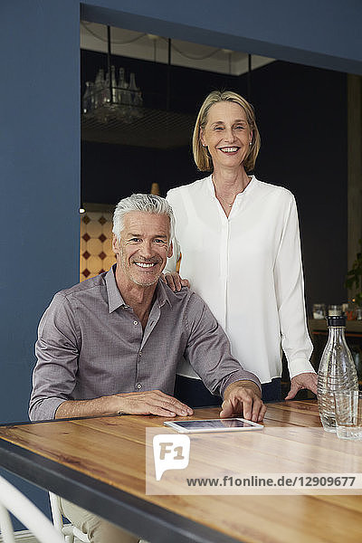 Portrait of smiling mature couple at home