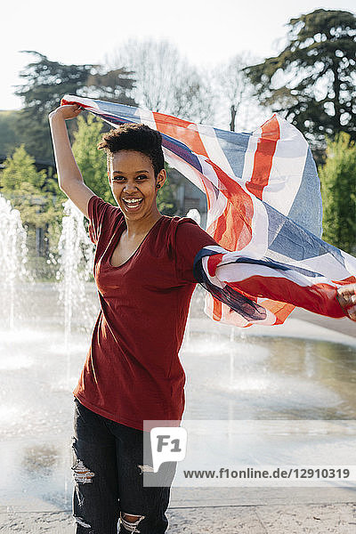 Portrait of happy young woman with Union Jack