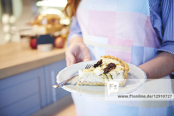 Close-up of woman serving cake in a cafe