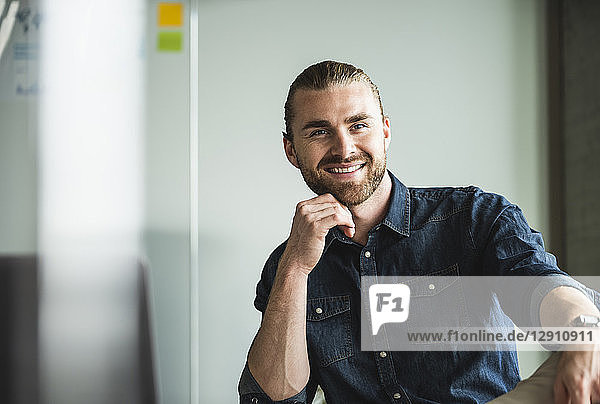 Portrait of smiling casual businessman in office