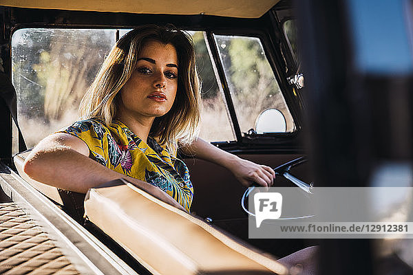 Portrait of young woman in a van