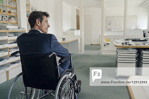 Disabled businessman sitting in wheelchair