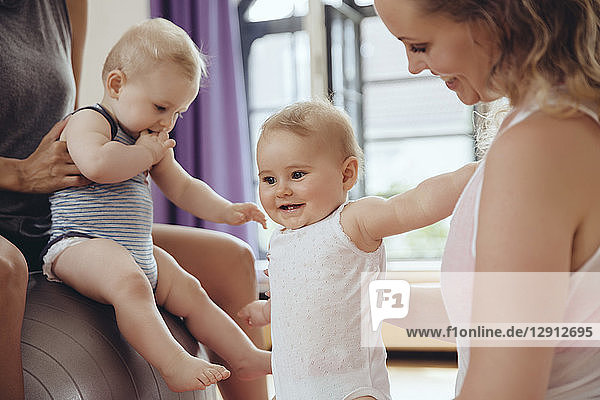 Mothers and babies in exercise room
