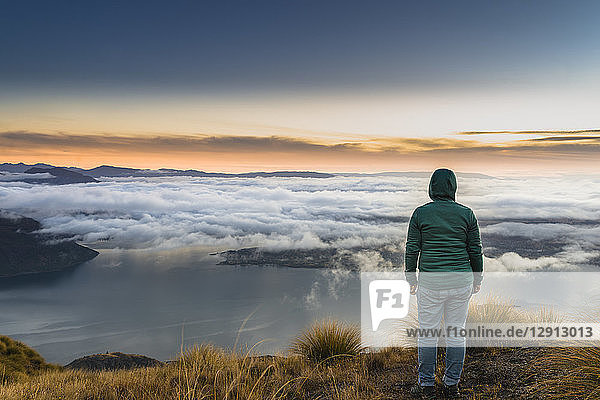 New Zealand  South Island  Wanaka  Otago  woman on Coromandel peak at sunrise