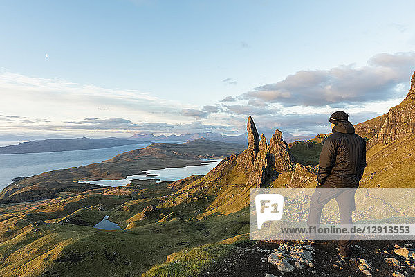 UK  Scotland  Inner Hebrides  Isle of Skye  Trotternish  tourist on peak near The Storr