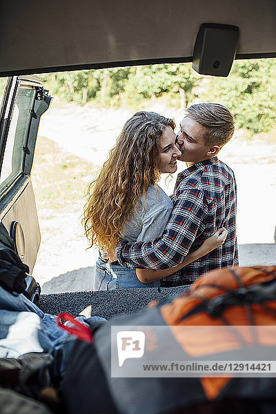 Romantic couple doing road trip  kissing