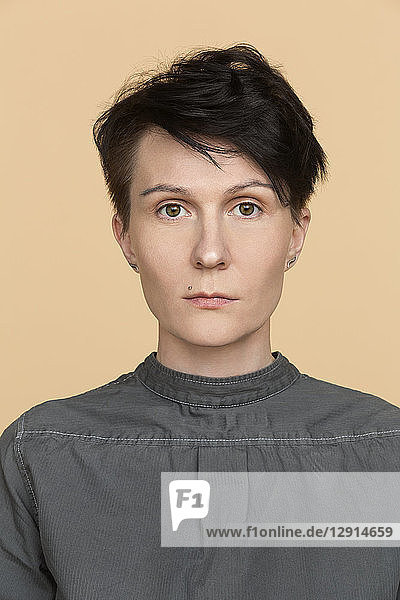Portrait of serious woman with short hair