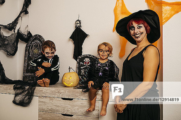 Group picture of mother and her two children at Halloween