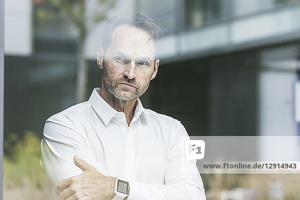 Businessman looking out of window