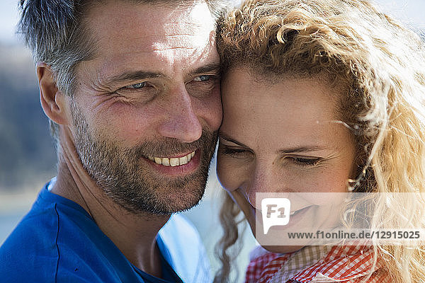 Portrait of happy affectionate couple outdoors