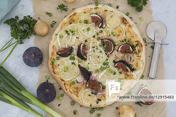 Homemade Tarte Flambee with figs  spring onions and goat cheese