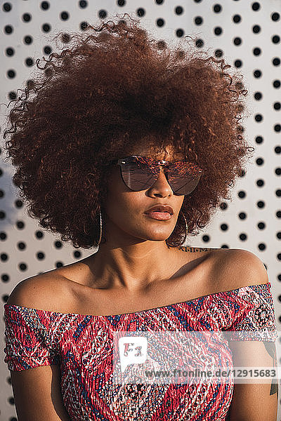 Portrait of fashionable woman wearing mirrored sunglasses