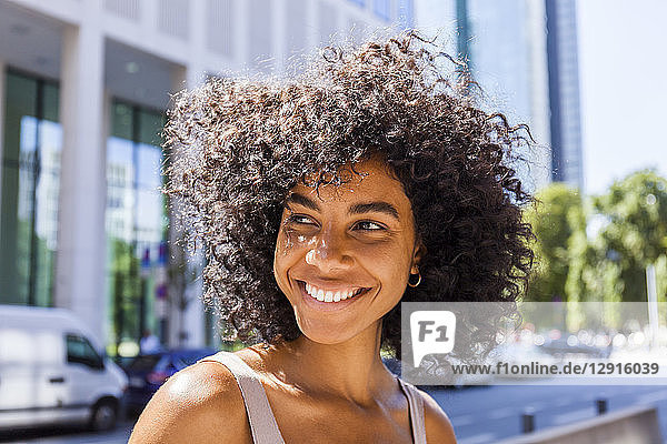 Germany  Frankfurt  portrait of laughing young woman with curly hair