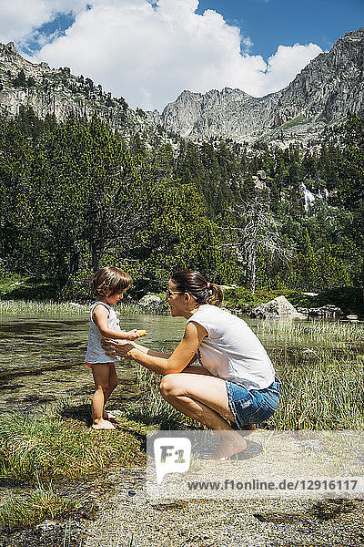 Spain  Mother and toddler exploring lakes in the Pyrenees