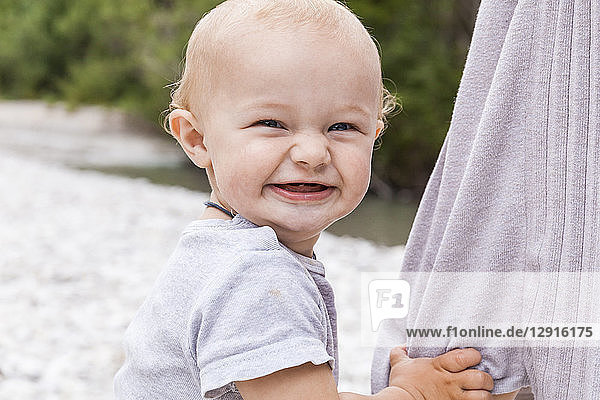 Portrait of happy baby boy outdoors