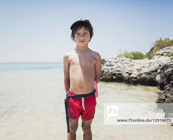 Portrait of a boy standing on the beach