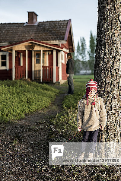 Finland  Kuopio  little girl with mother at a cottage in the countryside