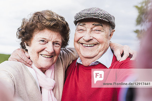 Selfie of happy senior couple outdoors