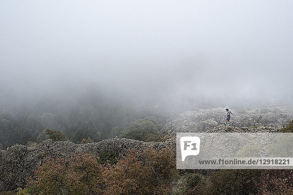Man running on ridge in El Chico National Park  Hidalgo  Mexico
