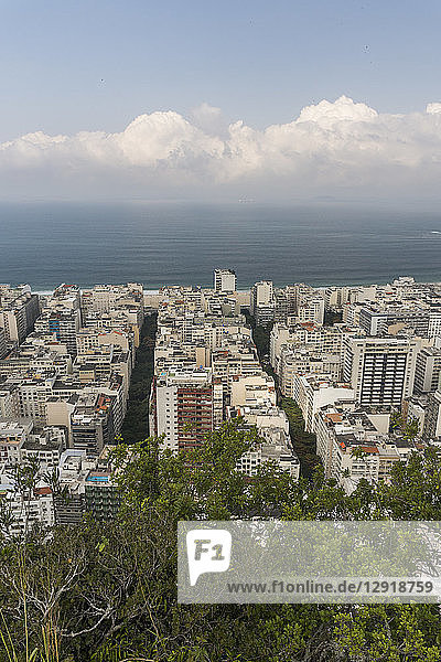 View of buildings in city and beach at Copacabana seen from Agulinha do Inhanga Rio de Janeiro Brazil