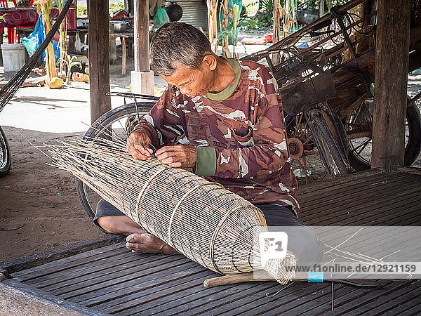 Man making a fish trap  village near Siem Reap  Cambodia  Indochina  Southeast Asia  Asia