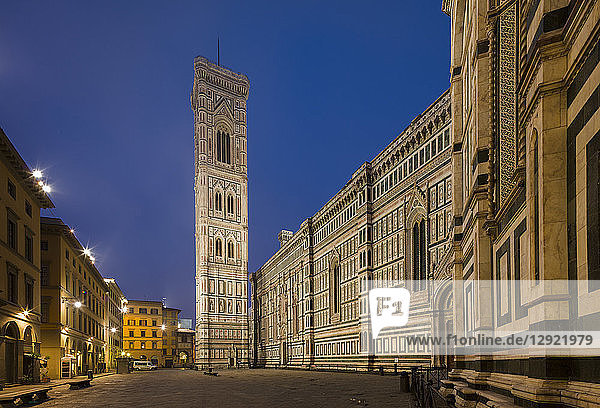 A deserted Piazza Del Duomo extends alongside the Cathedral (Duomo) to the Campanile in the early morning  Florence  UNESCO World Heritage Site  Tuscany  Italy