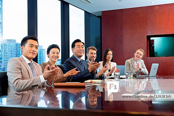 Business men and women in a meeting