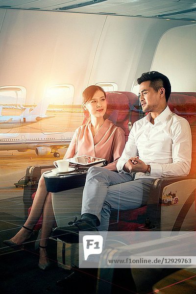 Business men and women by plane
