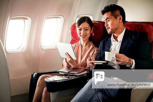Business men and women by plane