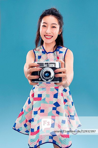 Young woman with a camera
