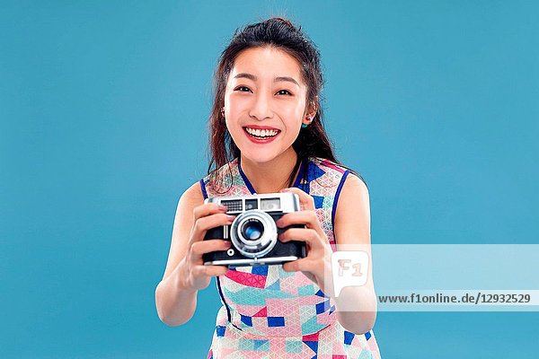 Young woman with a camera