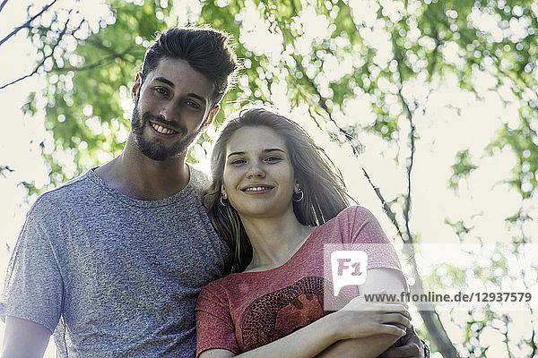 Young couple standing in park