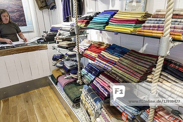 United Kingdom Great Britain England  London  Bloomsbury  Highland Store  Scottish Shop  shopping  lambswool  cashmere  scarf scarves  display sale  woman  sales clerk