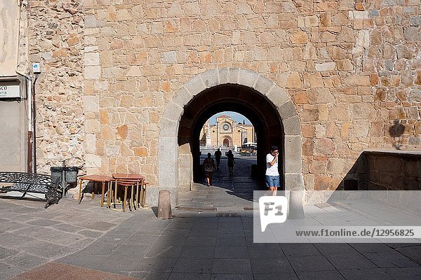 San Pedro Church at the Mercado Grande Square through an arch. Avila Community of Castilla-León Spain Europe.