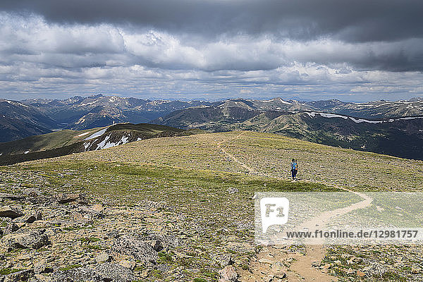Woman hiking trail on Berthoud Pass Trail in Colorado
