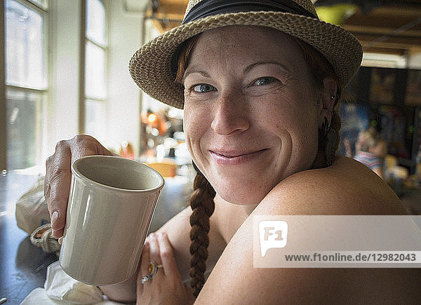 Woman drinking from coffee cup