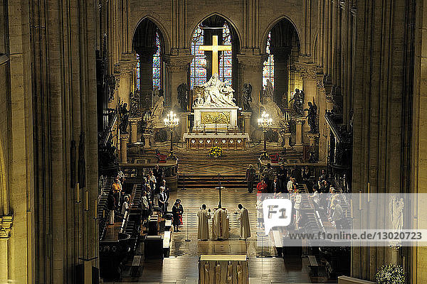 France,  Paris,  area listed as World Heritage by UNESCO,  Ile de la Cite,  Notre Dame Cathedral,  celebrating Mass in the chancel,  the Madonna and child on the right column at the level of the transept