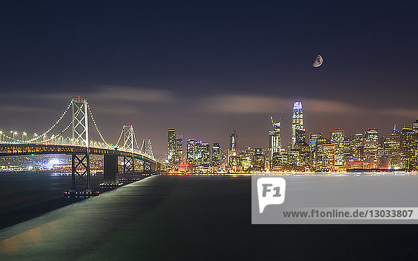 View of San Francisco skyline and Oakland Bay Bridge from Treasure Island at night  San Francisco  California  United States of America  North America